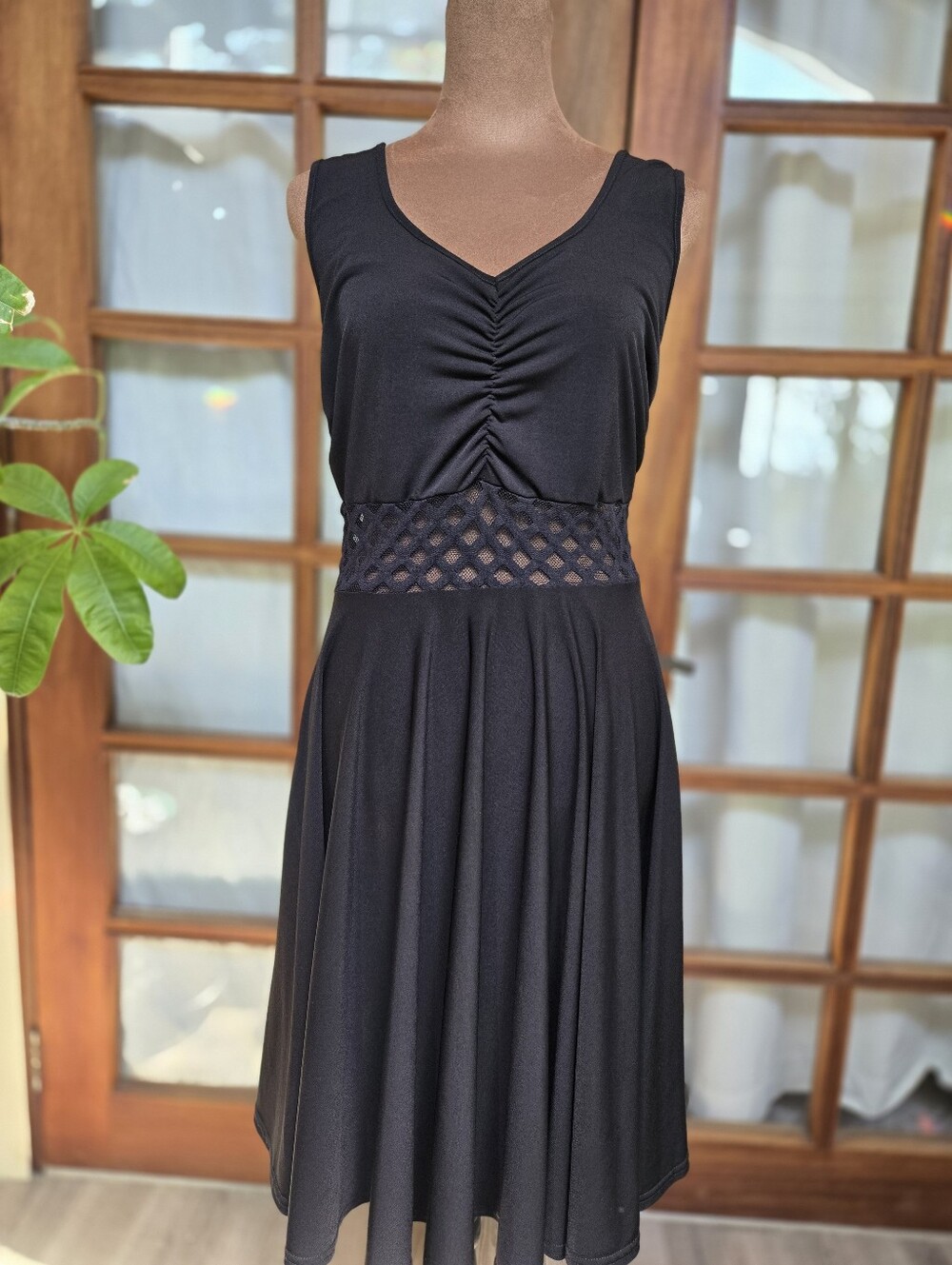 Classic Black Sleeveless Dress with Lace Waist